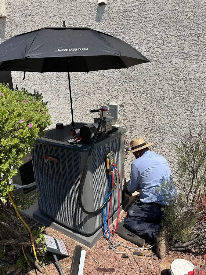 HVAC technician performing outdoor AC maintenance in Azusa